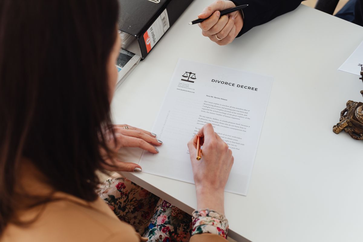 Refinancing Central Coast NSW homeowner reviewing loan documents with a mortgage broker